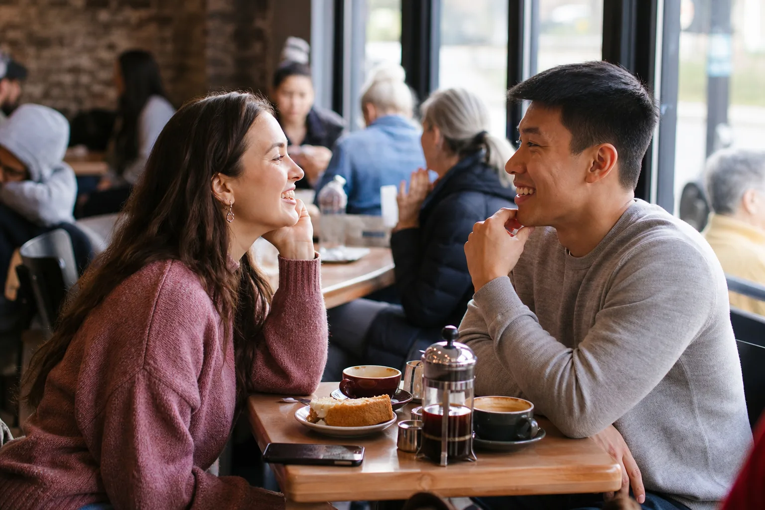 Two people talking over coffee in Warwickshire
